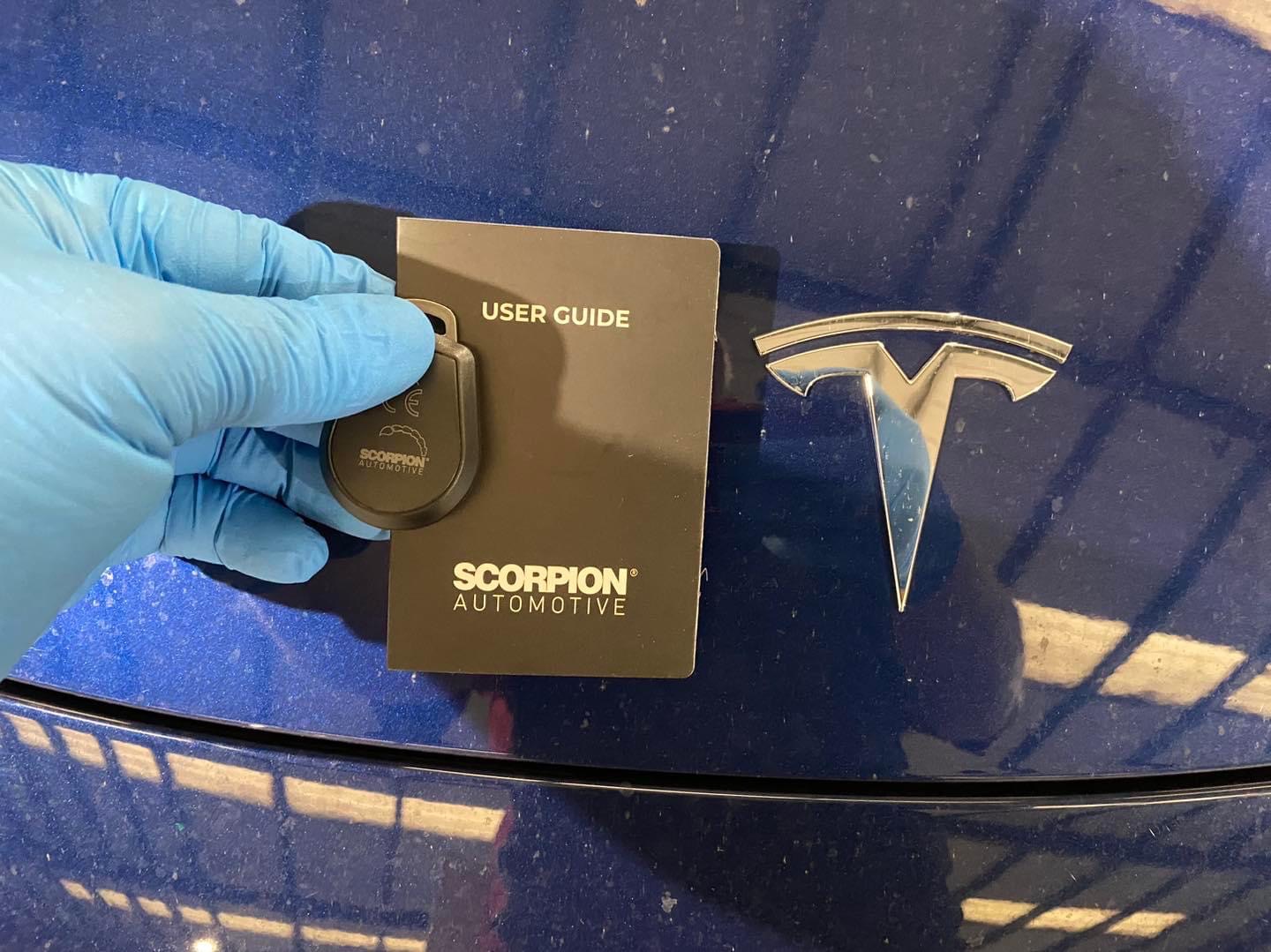 Scorpion tracker tag fitted to a Tesla